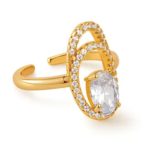 Detail of 18K gold ring with double oval design and micro-pave white zircon stones