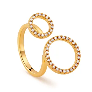 Detailed close-up of 18K gold star ring with micro-paved white cubic zirconia