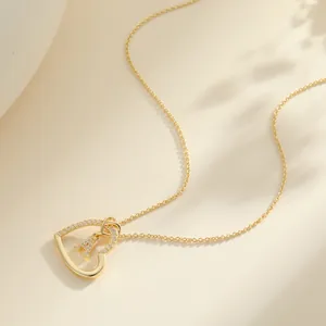 Elegant gold heart pendant necklace with zircon letter A and soft shadow aesthetic