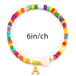 Rainbow beaded bracelet with gold letter A charm and heart bead, 6-inch circumference