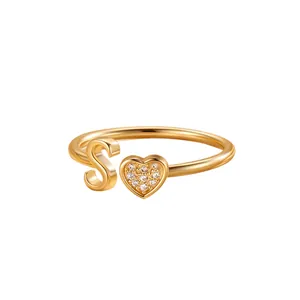 Adjustable gold heart ring featuring letter S with sparkling cubic zirconia inlay