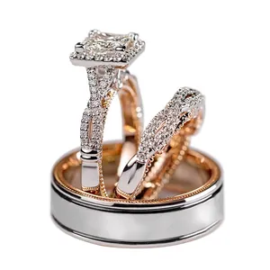 Three-piece wedding ring set featuring square-cut halo solitaire and two-tone bands