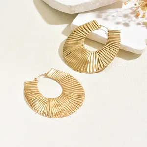Chic gold-plated U-shaped hoop earrings with elegant pleated texture for women