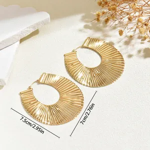 Large vintage gold U-shaped statement earrings with textured radial pleats for women