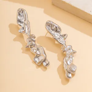 Abstract silver liquid metal earrings with irregular lava texture for a modern look