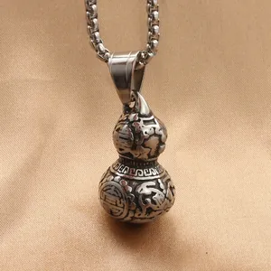Vintage stainless steel gourd pendant with longevity engraving on brown silk background