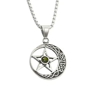 Macro detail of pentagram moon pendant with olive green stone and vintage steel texture