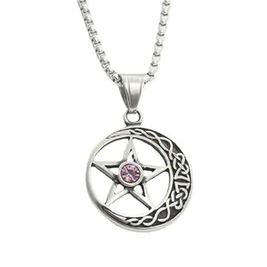 Close-up of retro punk star pendant with purple crystal and gothic moon crescent detail