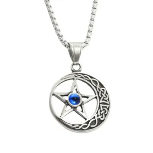 Macro view of vintage steel crescent moon and pentagram pendant with a blue gemstone