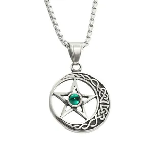 Detail of gothic star pendant with green bead and celtic moon pattern in vintage steel