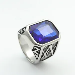 Macro view of blue rectangular gemstone and Masonic symbol engraving on steel ring