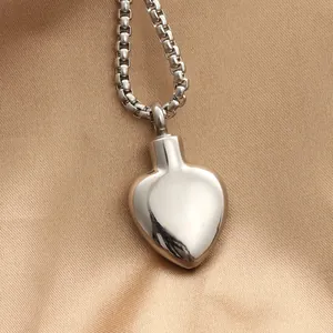 Polished heart perfume bottle pendant in stainless steel with a sturdy box chain