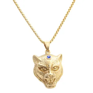 Collana con ciondolo testa di tigre in acciaio dorato e gemma blu su catena a scatola