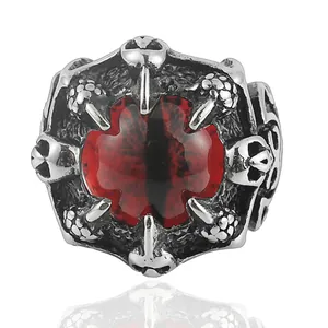 Retro punk dragon claw ring with red gemstone and skull embossing on silver steel