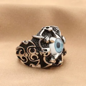 Punk style dragon claw ring with blue evil eye and skull engraving in stainless steel