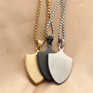 Three punk shield necklaces in gold black and silver stainless steel with box chains