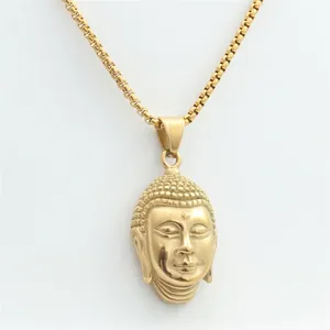 Detailed close-up of golden Buddha head pendant featuring a classic box chain design