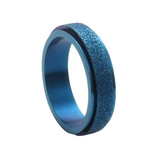 Blue matte titanium steel spinner ring with a textured finish and rotatable design