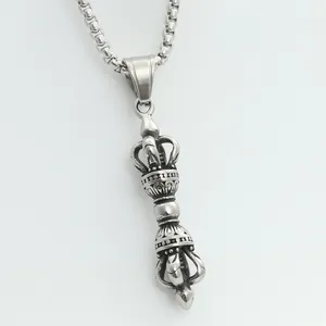 Macro view of silver stainless steel Vajra pendant with antique texture and pearl chain