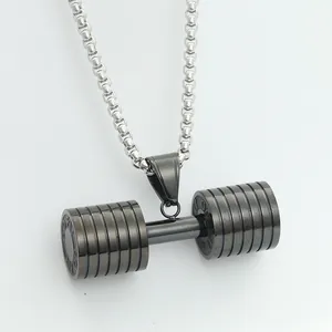 Detailed macro view of dumbbell pendant with GO FIT engraving and vintage box chain