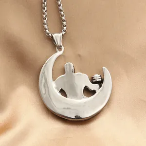 Silver dumbbell gym necklace with crescent moon and fitness silhouette on silk background