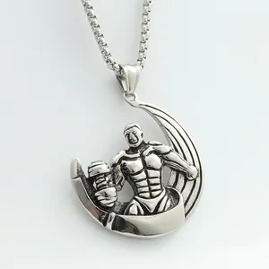 Macro shot of silver dumbbell fitness pendant with muscle man detail on box chain