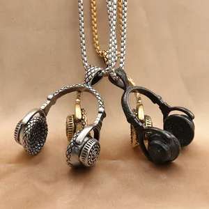 Macro detail of headphone pendant necklaces in silver, black and gold steel