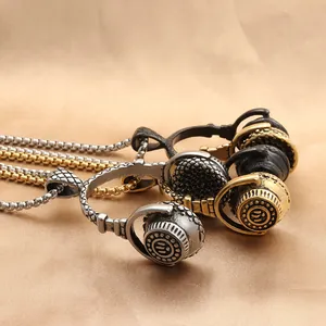 Detailed macro view of vintage headphones pendant in silver, gold and black stainless steel