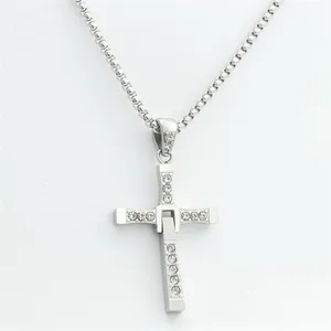 Detail of silver titanium steel cross pendant with sparkling rhinestones and box chain