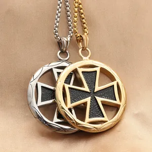 Detail of gold and silver steel cross pendants on a satin background with box chains