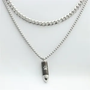 Detail of bullet pendant with paw print on double-layered stainless steel chains
