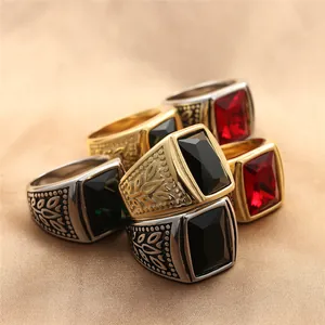 Macro shot of men's vintage punk rings featuring large square gems and embossed leaf details