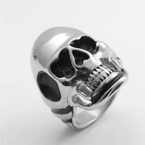 Macro shot of punk style stainless steel skull ring with vintage blackened finish details