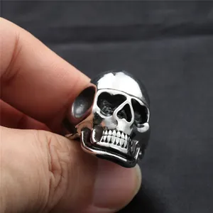 Detailed view of punk style stainless steel skull ring with vintage metallic finish