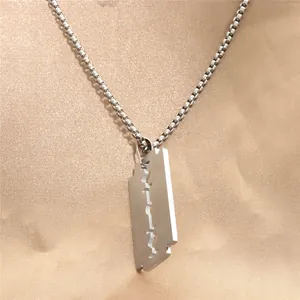 Punk style titanium steel razor blade pendant with high polish on champagne satin cloth