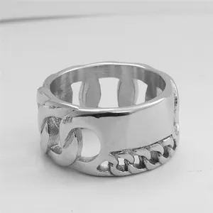 Macro view of silver stainless steel ring featuring hollow Cuban link texture design