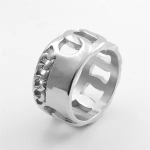 Macro detail of silver stainless steel ring featuring bold Cuban chain link design