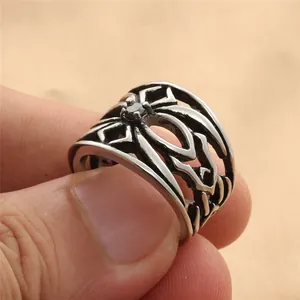 Macro detail of gothic punk hollowed ring with a central black gemstone setting