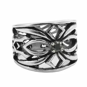 Punk retro hollow stainless steel ring with black round gemstone on white background