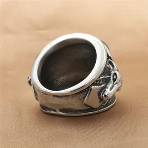 Vintage stainless steel ring for men with green stone inlay and antique relief carving