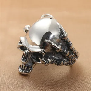 Macro detail of vintage skull ring with intricate bone texture and antique silver finish
