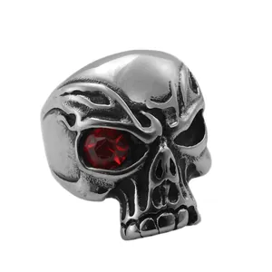 Vintage stainless steel skull ring with red rhinestone eye inlay in gothic punk style