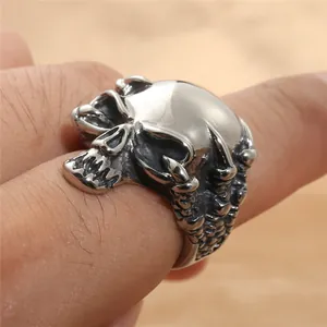 Gothic punk skull ring in vintage stainless steel with intricate bone carvings for men