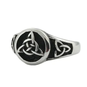Macro shot of silver Celtic knot ring with vintage oxidized finish on stainless steel