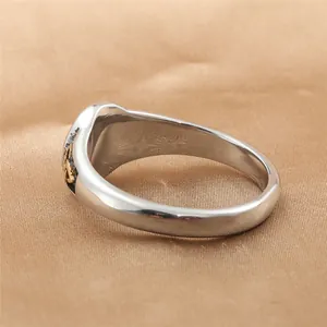 Punk style stainless steel Irish knot ring with silver finish and gold side details