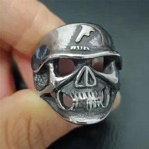 Detailed view of vintage steel skull ring with embossed forehead emblem in punk style