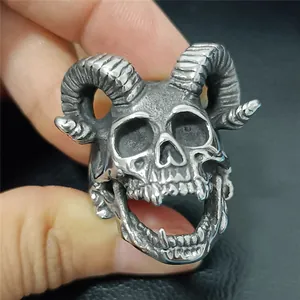 Macro detail of retro skull ring with ram horns in vintage matte steel finish