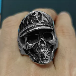 Macro view of vintage silver skull ring with officer hat and gothic punk relief detailing
