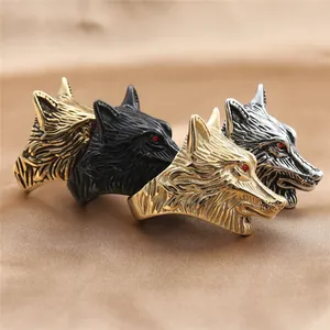 Detailed relief of wolf head ring in silver gold and black with red rhinestone eyes