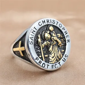 Macro view of Saint Christopher stainless steel ring with gold cross and engraving